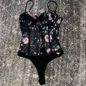 Selling a bodysuit is see-through in the stomach part.